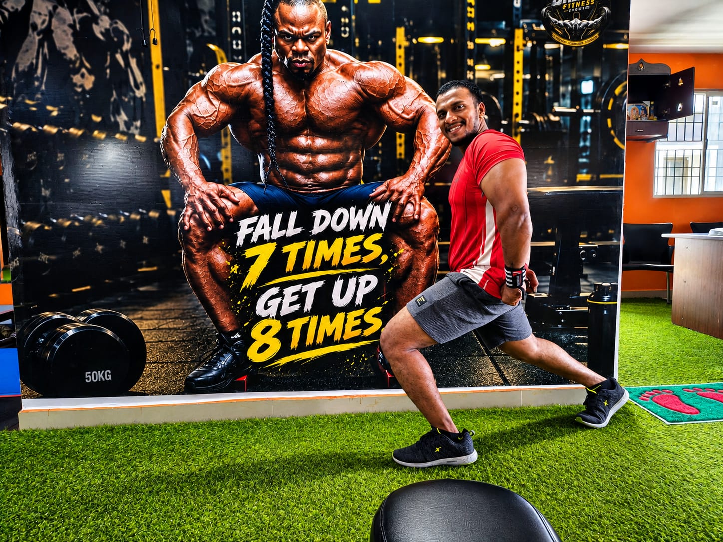 Member stretching on the training turf at Shree Fitness, a unisex AC gym in Porur, Chennai